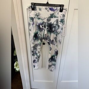 Athleta Mudra 7/8 Women’s Leggings - White and Purple Floral. NWT Medium Petite